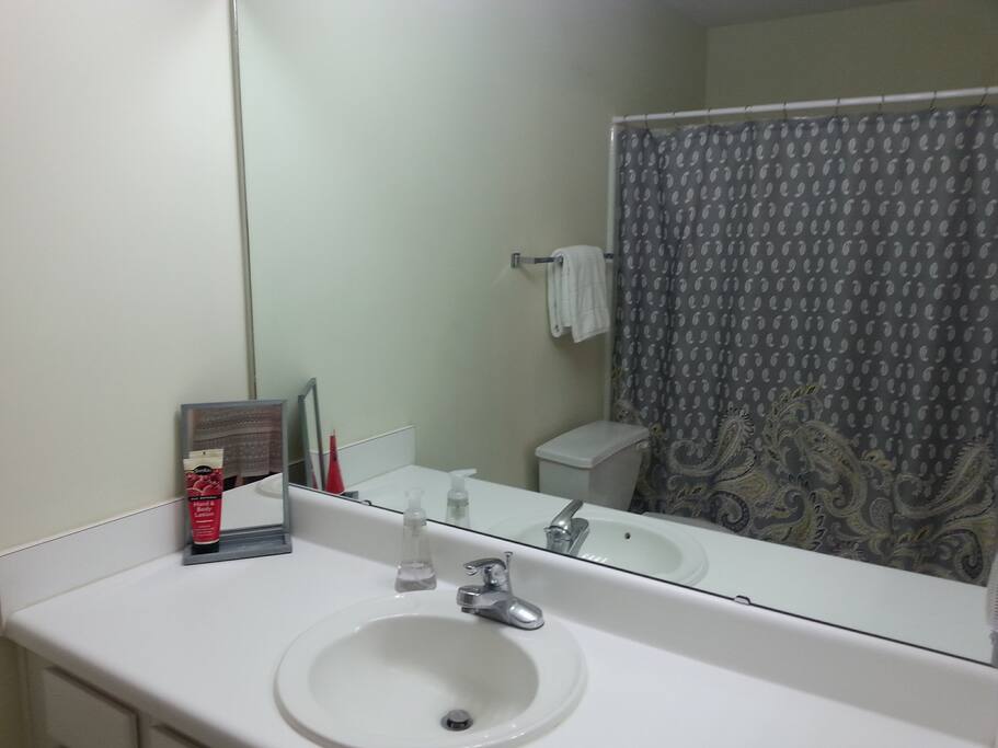 En Suite bathroom with back bedroom.