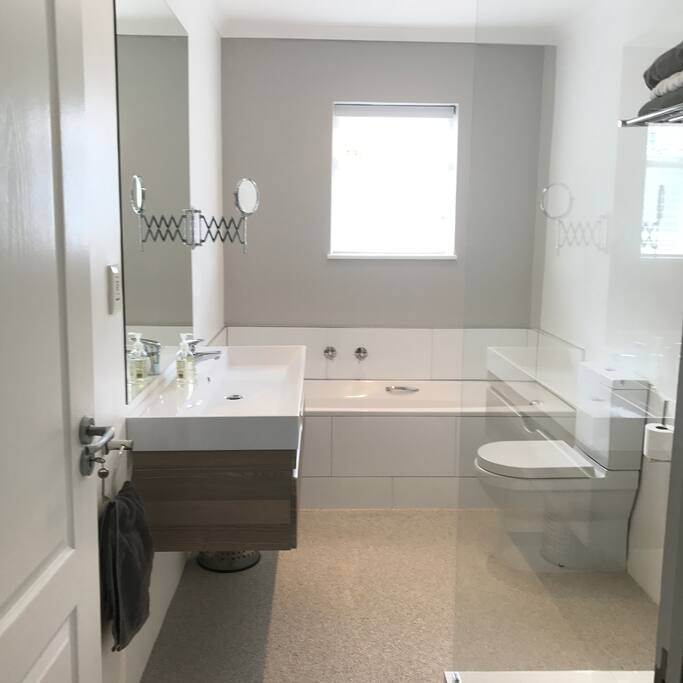 Main on-suite bathroom with natural quartzstone flooring - 1 x 1.5 open shower & 1.2m large basin.