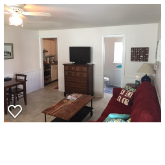 New tile has been added throughout the apartment, and there is a full-sized, pull-out sleeper sofa.
