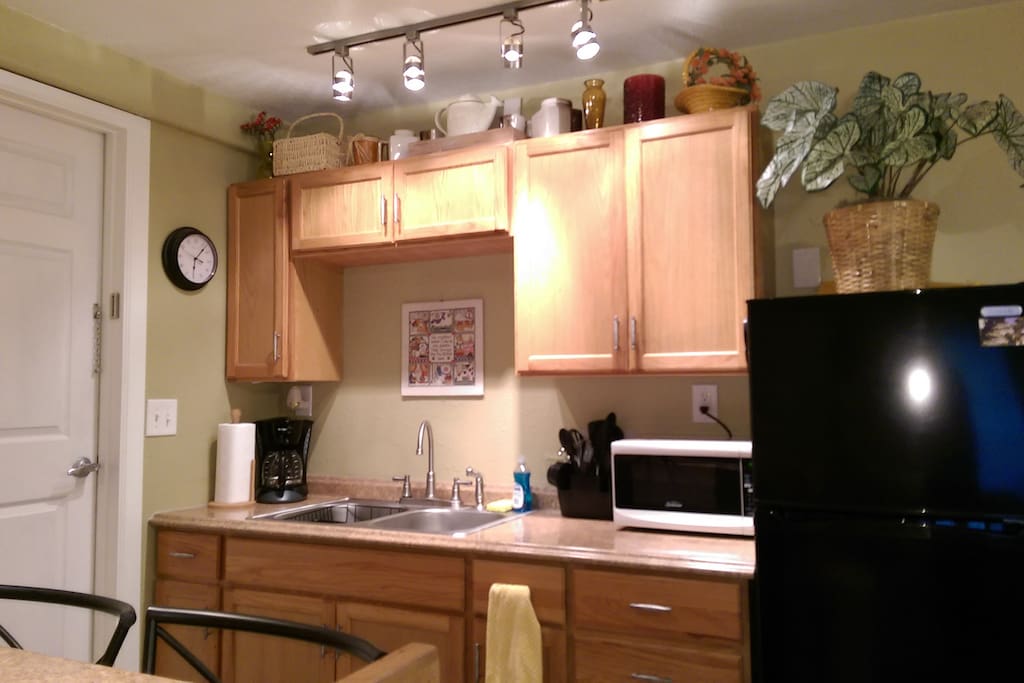 Kitchenette with fridge, microwave, and coffee maker