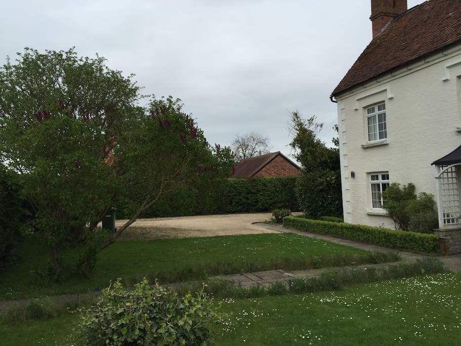 Parking area, also one parking space at the back of the house