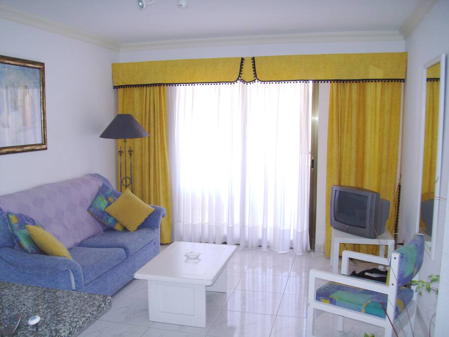 Reception room and sliding door to balcony.