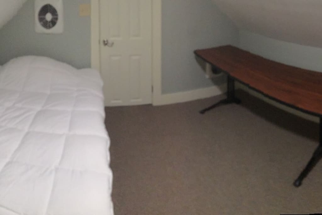 Full bed, memory foam mattress. Table to work. There is also a small nightstand and an office chair in the room.