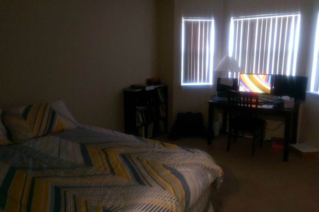 Guest room: comfortable queen size bed, beautiful bay window with a computer desk.
