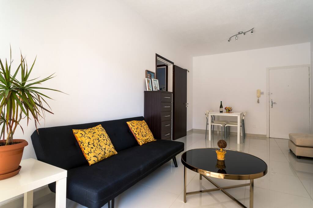 Living Room: Couch, Dining Table with 4 Chairs