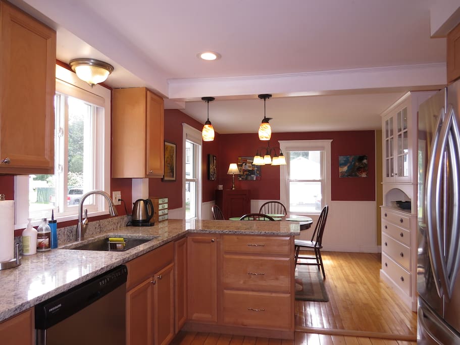 Kitchen/dining area. Corkscrew is in that top drawer in the kitchen cabinets!