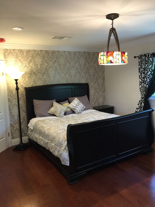 Master bedroom - King bed (new wood floor and wallpaper and paint)