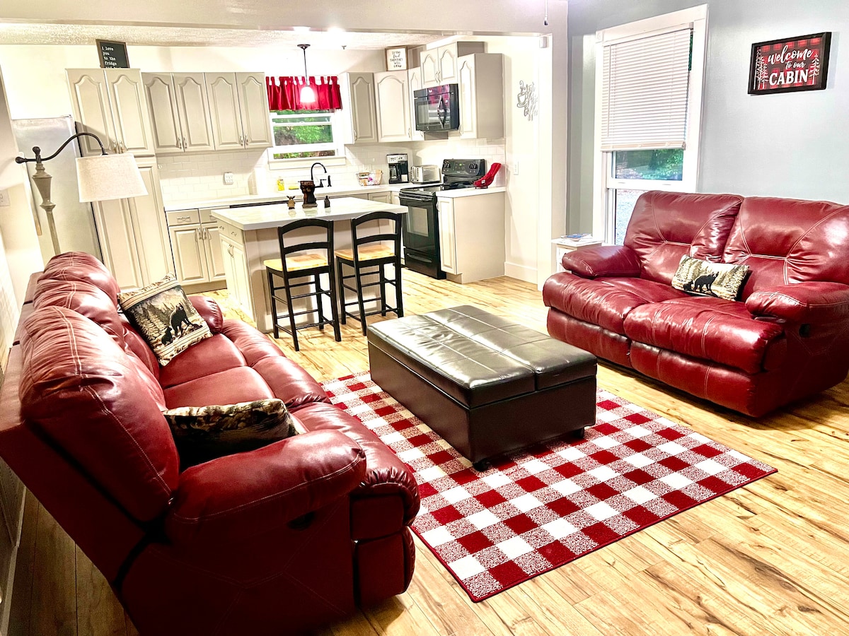 Living area with comfortable rocking and reclining furniture opens into the fully equipped kitchen. Island seats 2.  Eating table is in the attached breakfast nook.