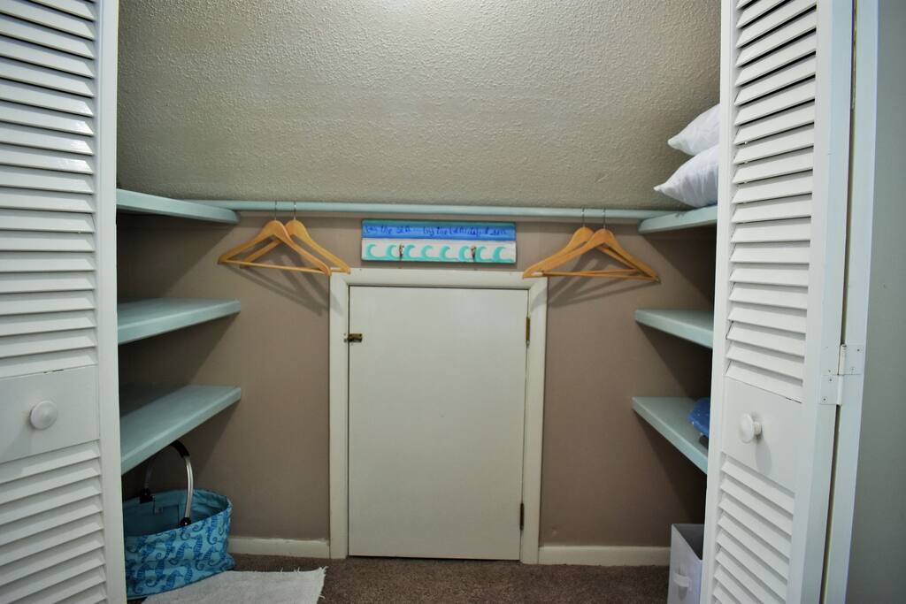 Walk in Closet with plenty of space for all of your personal belongings, hangers, an Ironing board and Iron.