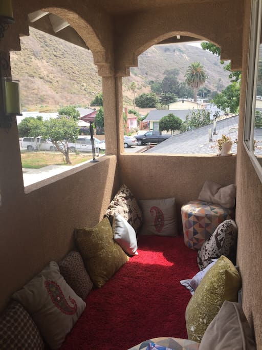 Moroccan style carpeted balcony with close up mountain views. Great place to take a nap too! :)