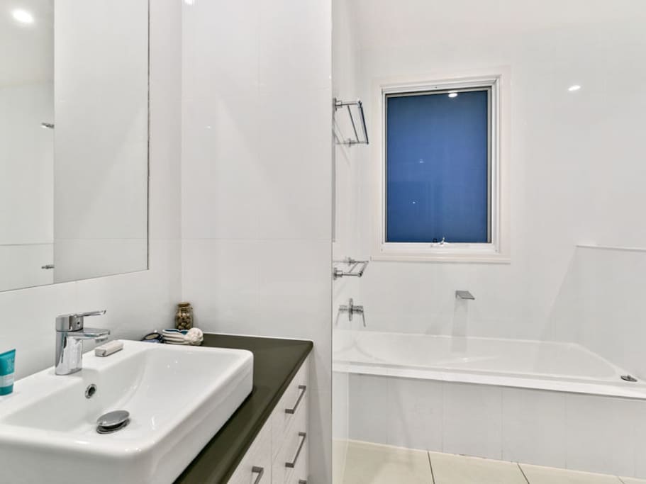 Bathroom with shower and bath