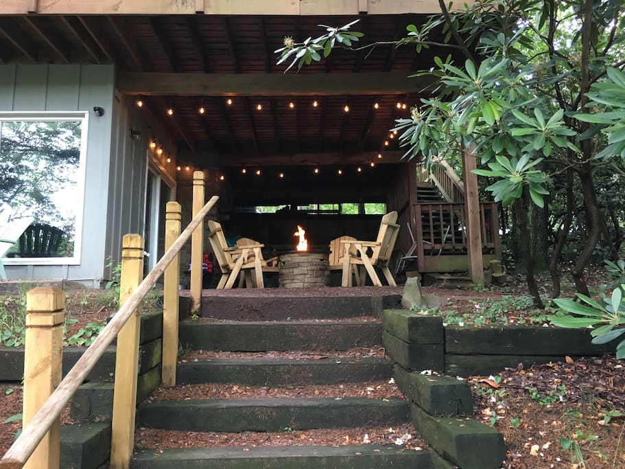 Hangout space under the deck with propane fire pit.