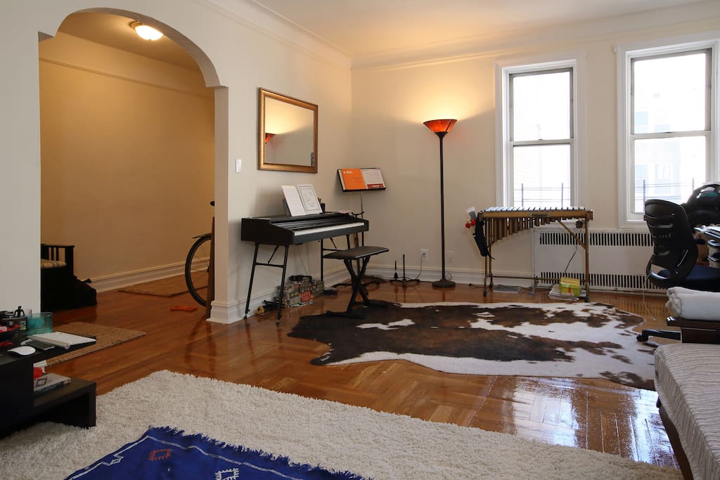 A shot of the foyer and beautiful curve architected entryway. The entry bench in the foyer is great for taking on and off your shoes. Also, we just ordered new blinds for the windows. They'll be installed before you arrive for some added privacy.