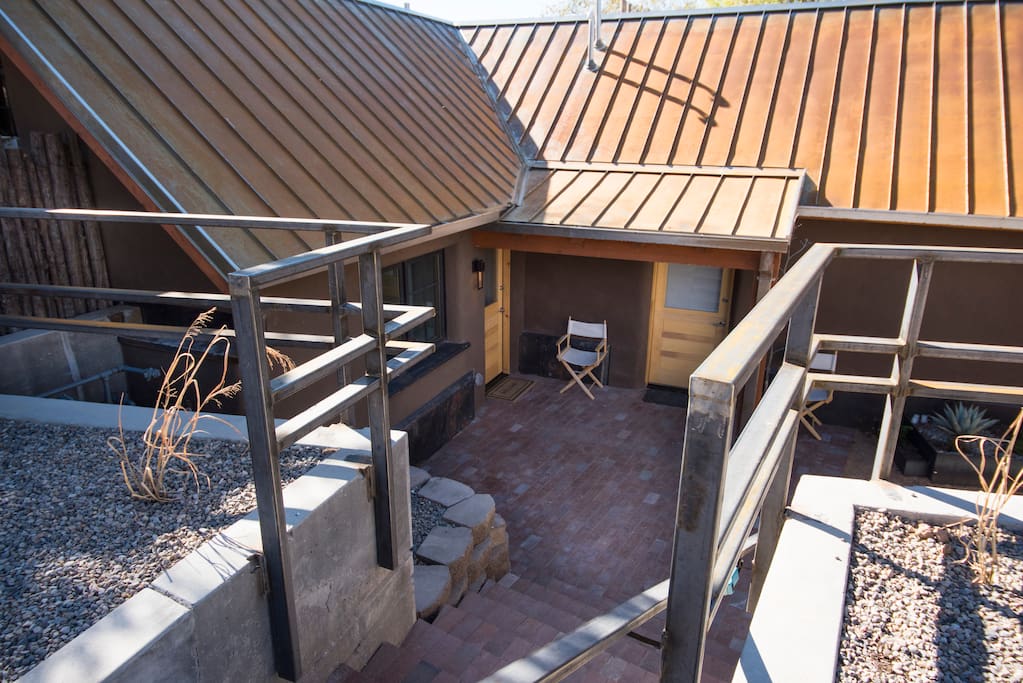 12 steps down to a beautiful shared front courtyard.