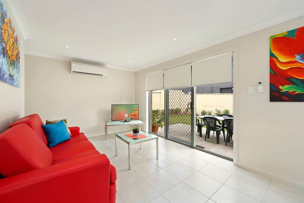 Second Living Area with access to secure, grassed backyard