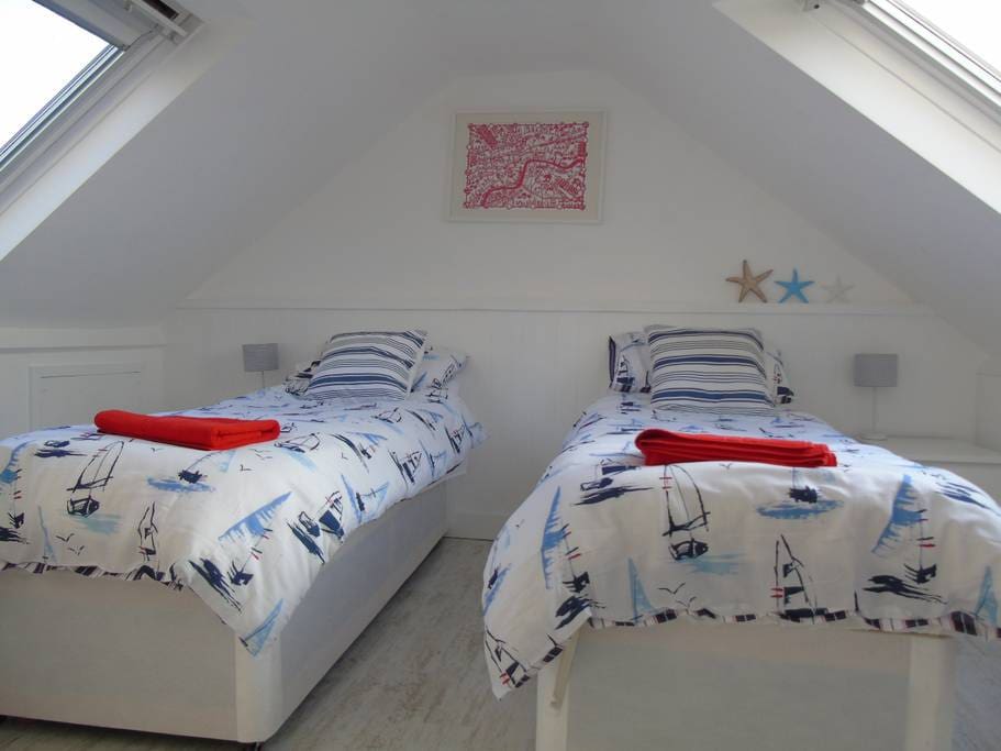 Attic bedroom made up as a twin.