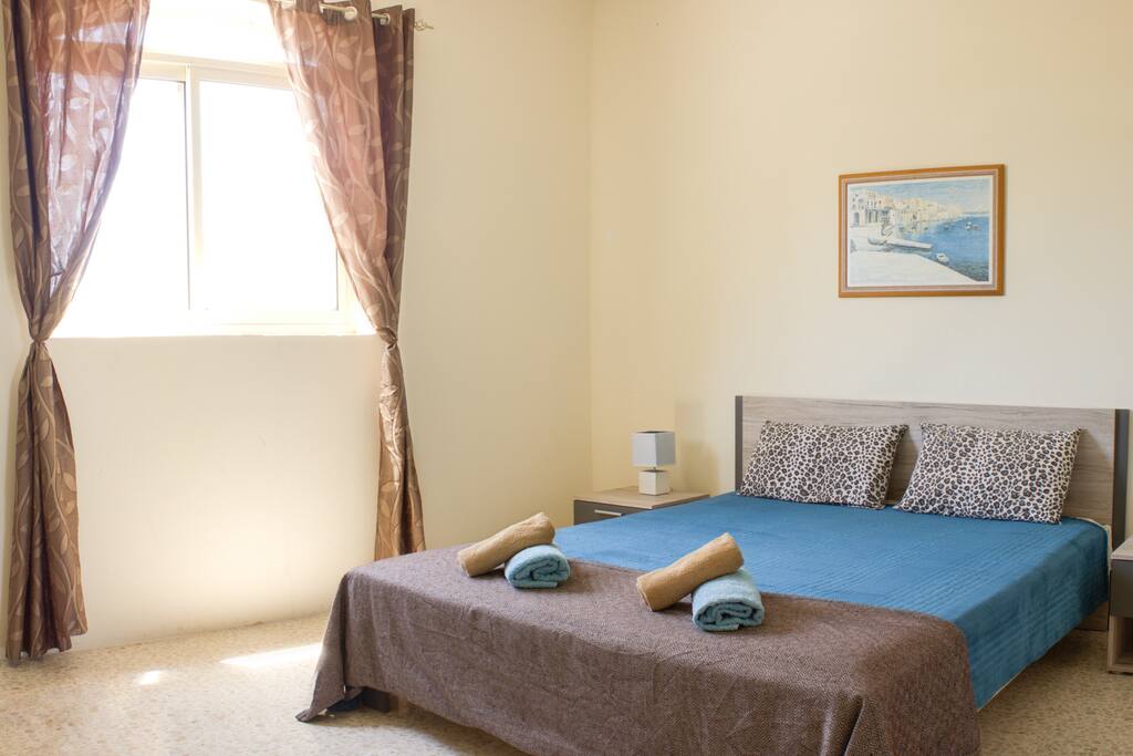 Bedroom with luxurious King-Sized Bed (160cm width) and Countryside View. Towels are provided.