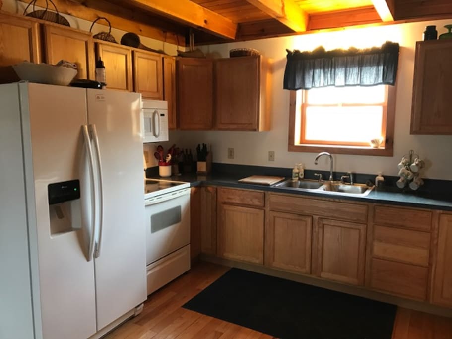 Kitchen with Fridge, Stove, Microwave