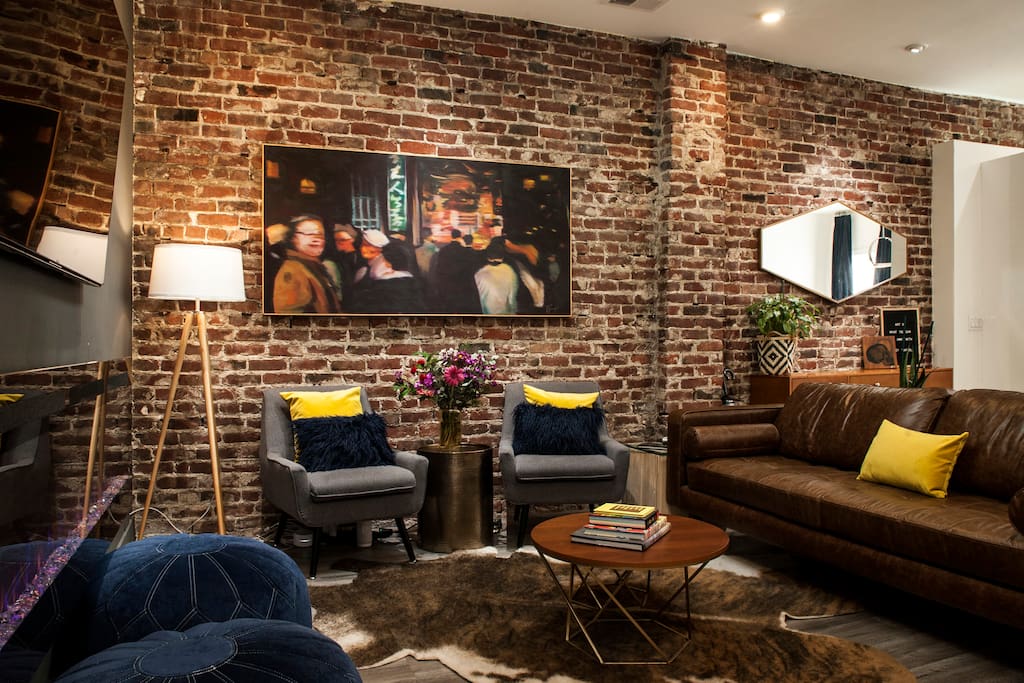 Located above a soon-to-be-opened gallery, guests will enjoy art from local and national names throughout the home. A variety of styles will rotate on the exposed brick walls from the turn of the century. (Shown: Manuel Fabregas)