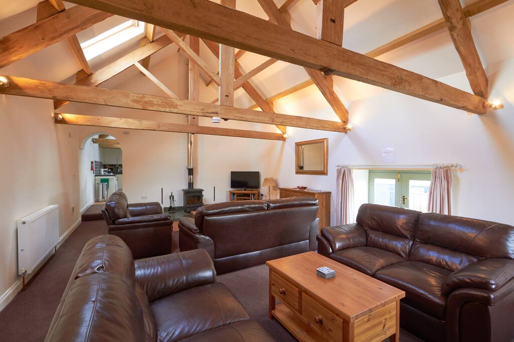Large living room with wood burning stove