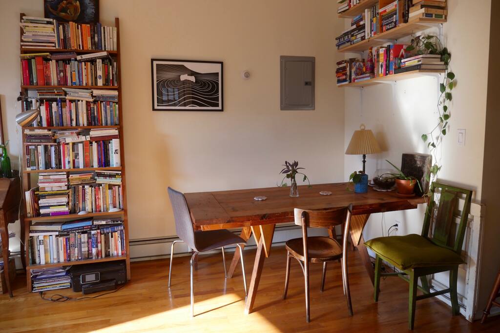 Make yourself at home at our large wooden dining table / work table.