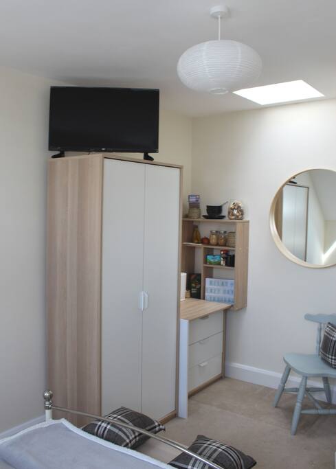Wardrobe and drawers for storage space (and a smart TV!)