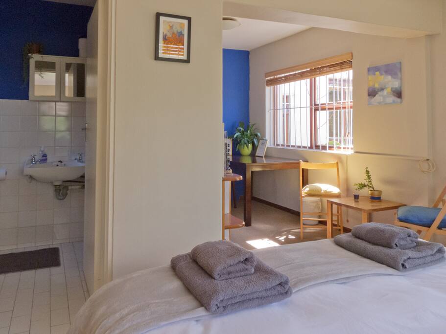 En suite bathroom, bed and sitting area