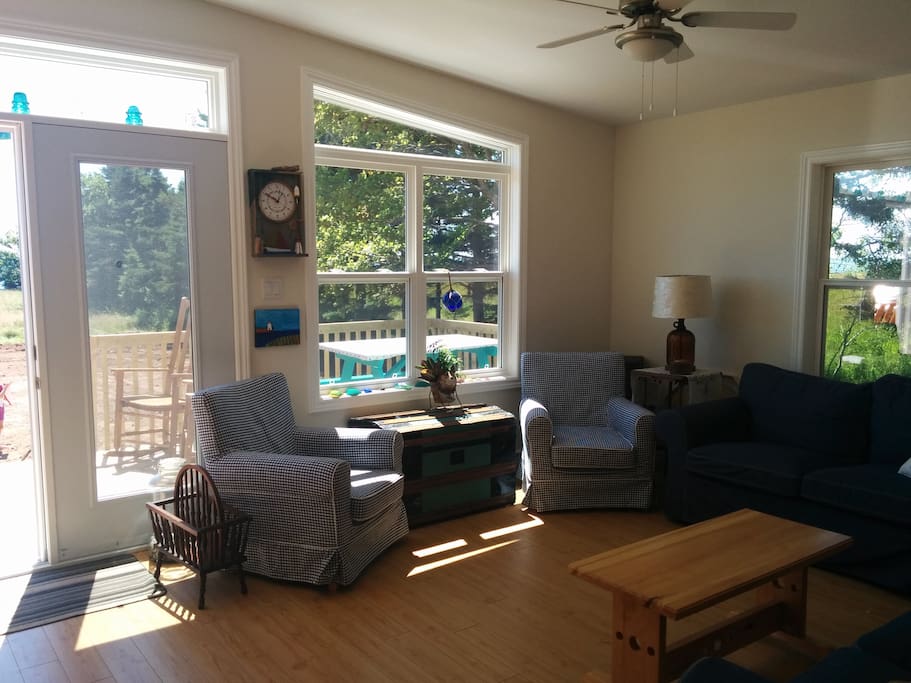 Enjoy the sunshine from the living room or the deck, the tide clock on the wall will help you keep track of the tides and the best times to head to the beach!