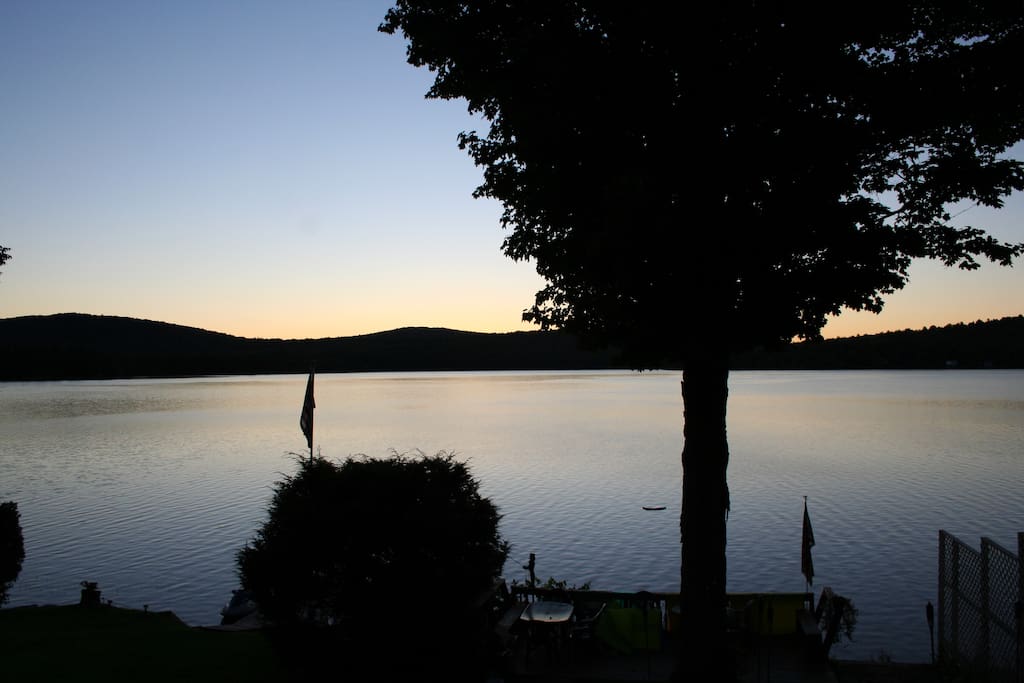 View right off the porch to the private dock and deck with outdoor dining set.