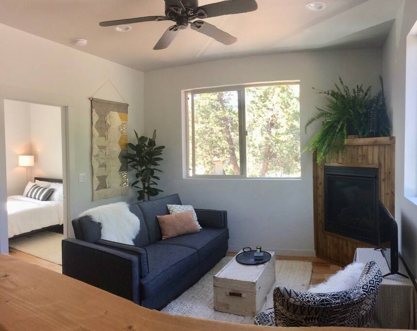 Tall ceilings feel airy as the second-story large windows frame the trees just outside. (shot from kitchen)