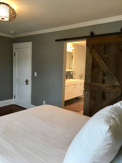 View from the bed to the ensuite bathroom
