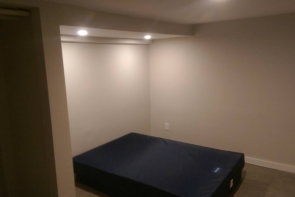 Bedroom with a full bed and closet