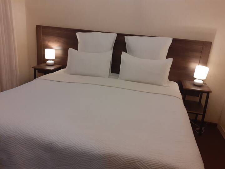 Bedroom  Number 4 with a King Bed, fitted bedroom cupboards,  there is an option available to have twin single Beds in the room.