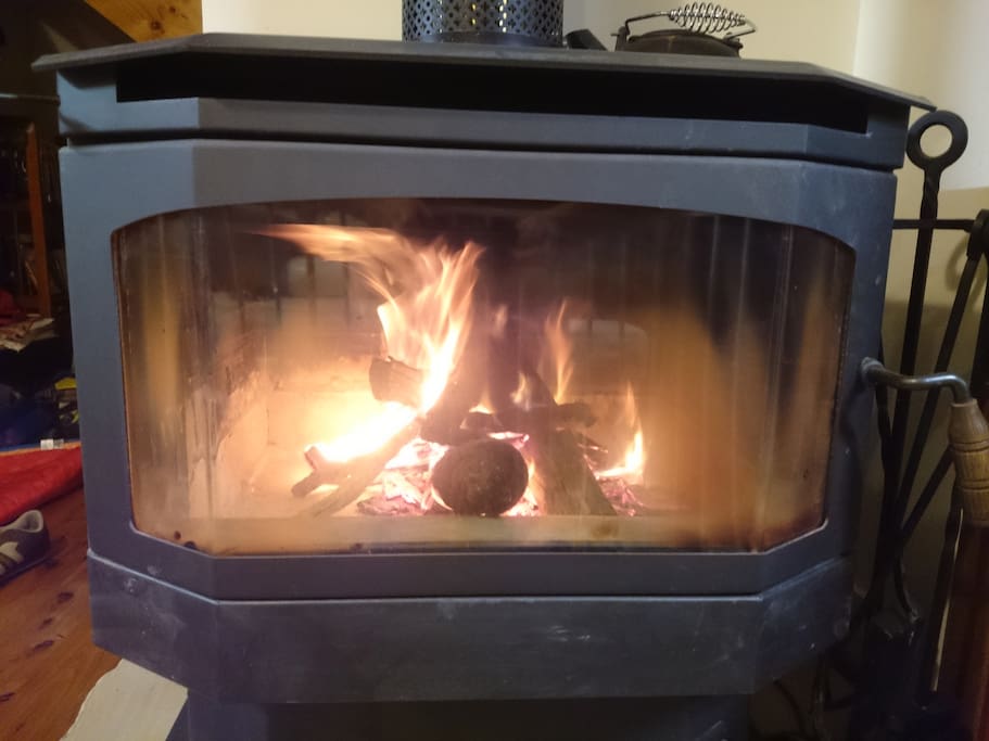 Large slow combustion fireplace for use from April -> October.