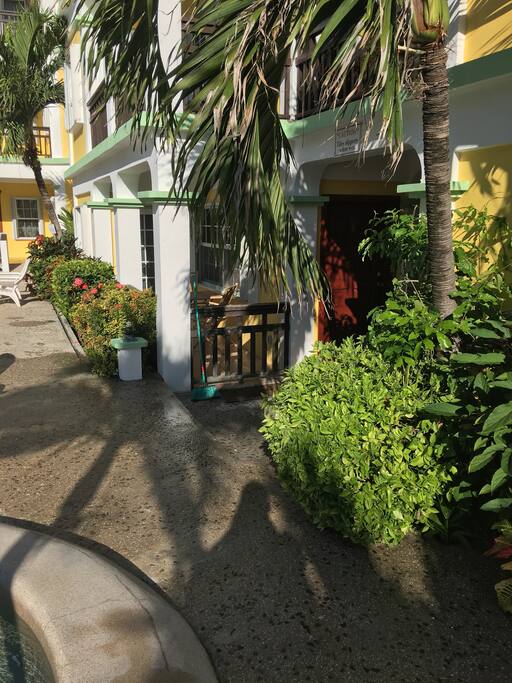 View of condo entry door from entry gate to the community