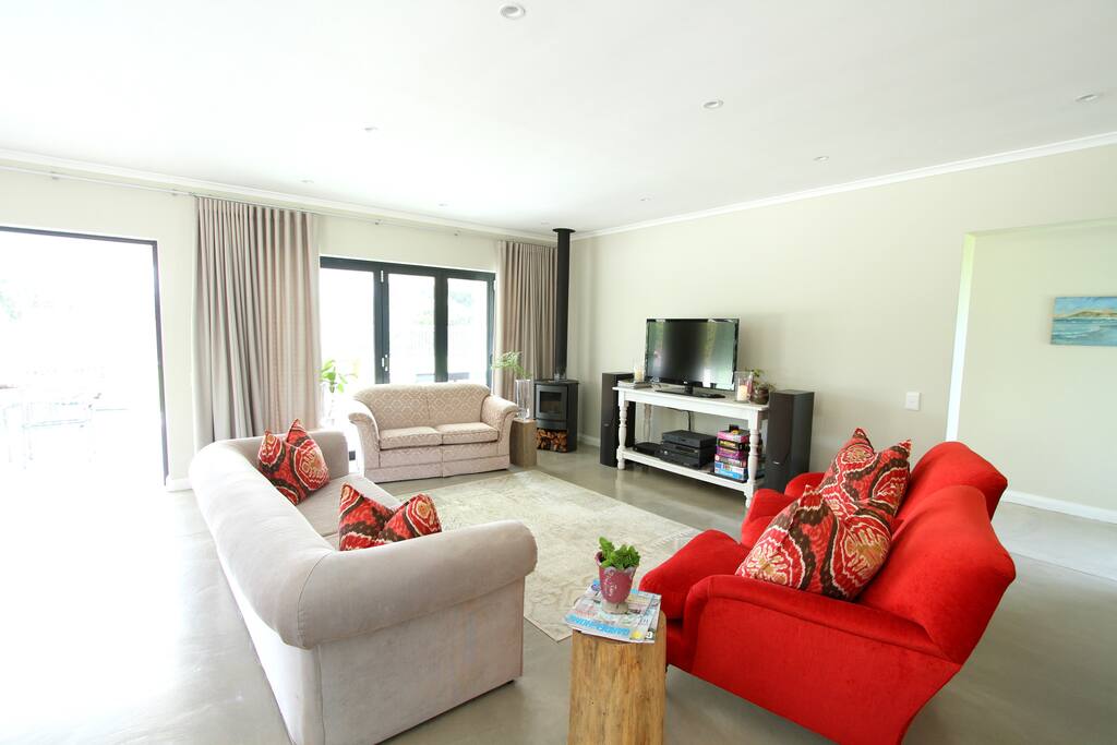 Large open plan lounge leading directly onto massive lawn area.