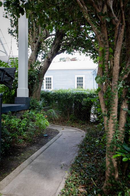 Walk path leading to the right of the home which leads to your entrance.