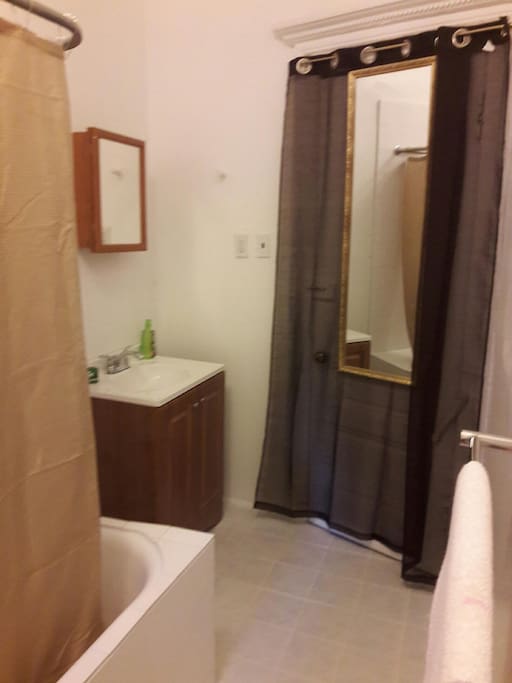 Private bath is freshly painted and re-tiled.