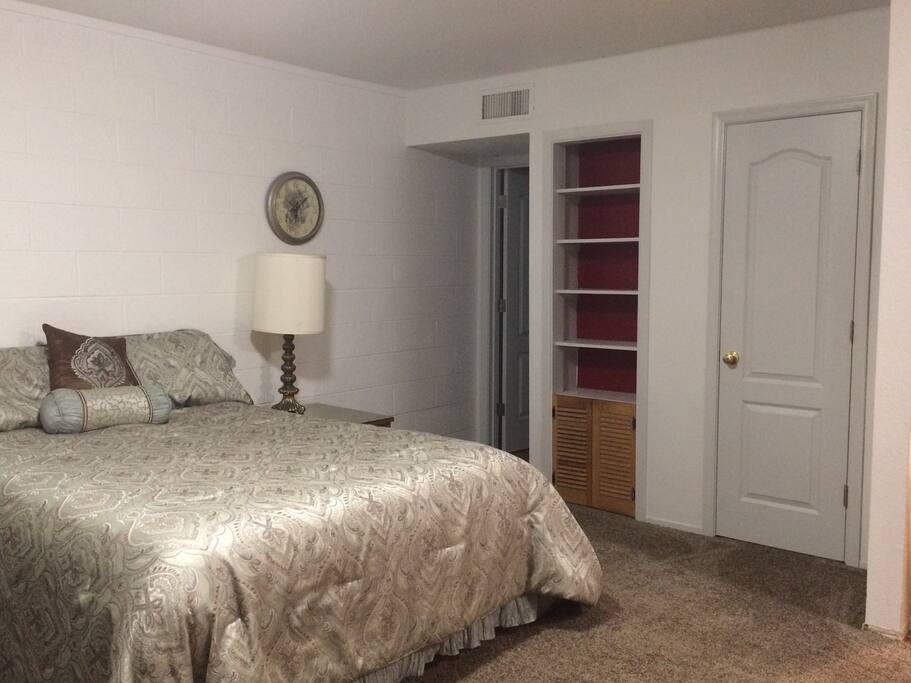 Facing bathroom door and closet door