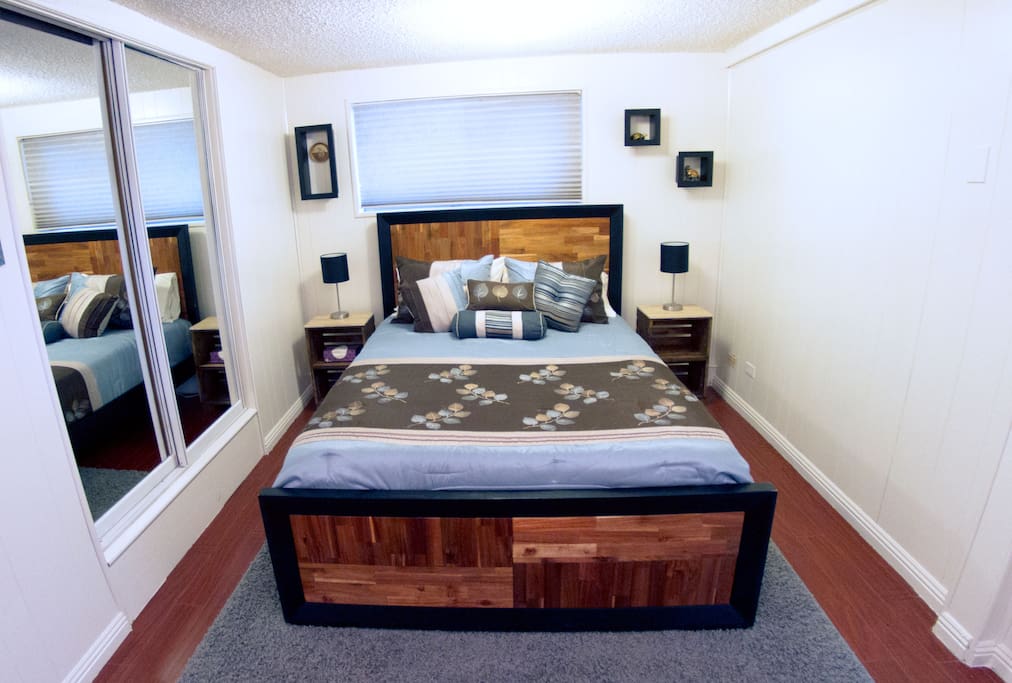 Queen bed in "bedroom" area
