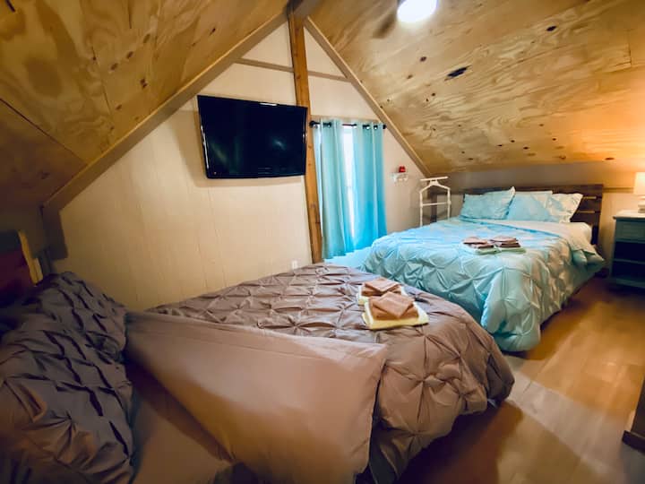 2nd loft, also 10x16, offers 2 comfortable full size beds, each have a night stand and lamp. Also, a TV with HDMI cord and Firestick. 