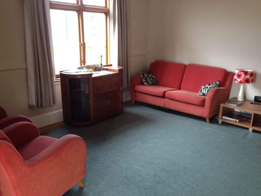 Cosy lounge with heat pump, wifi, seating for 4 adults.