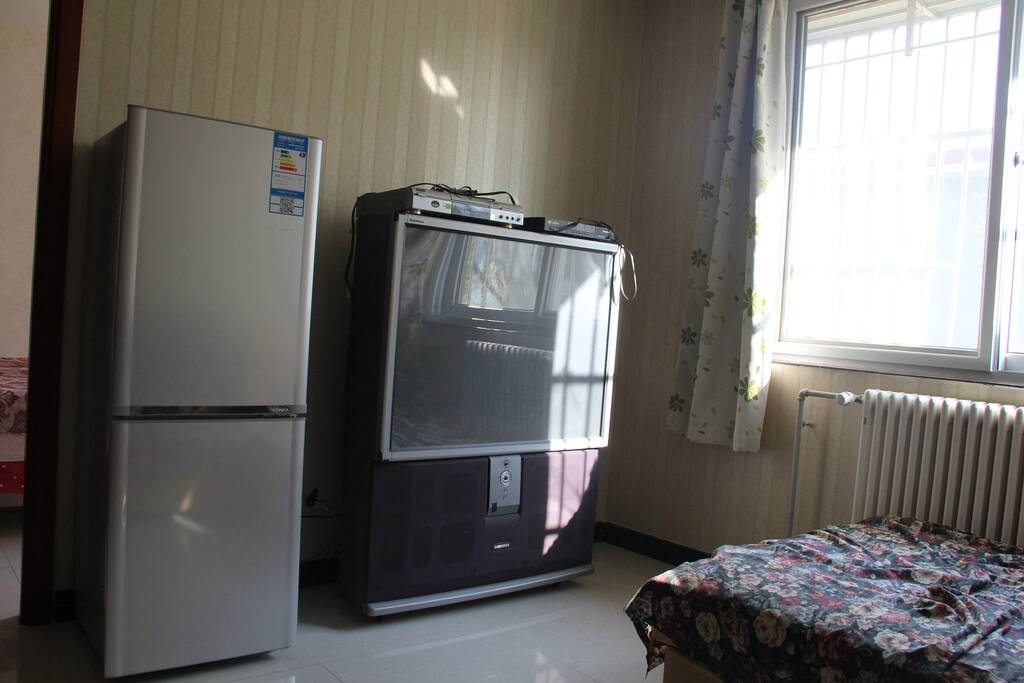 Sitting room equipped with refrige
