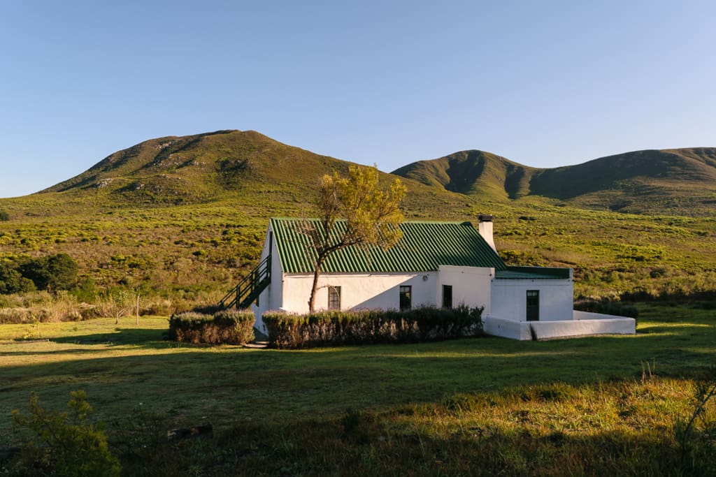 Back of cottage looking up valley