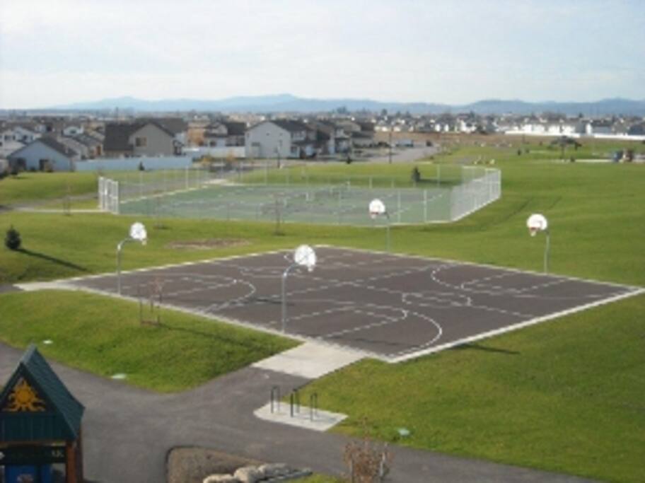 Basketball and tennis courts in the park around the corner.