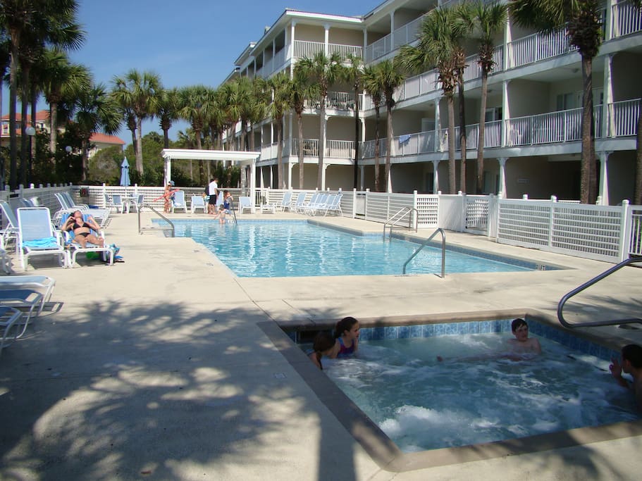 Relax in the heated pool and hot tub, just steps from your patio door.