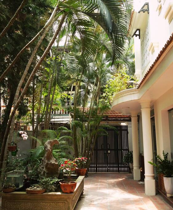 Shady entrance courtyard and French Indochina architecture