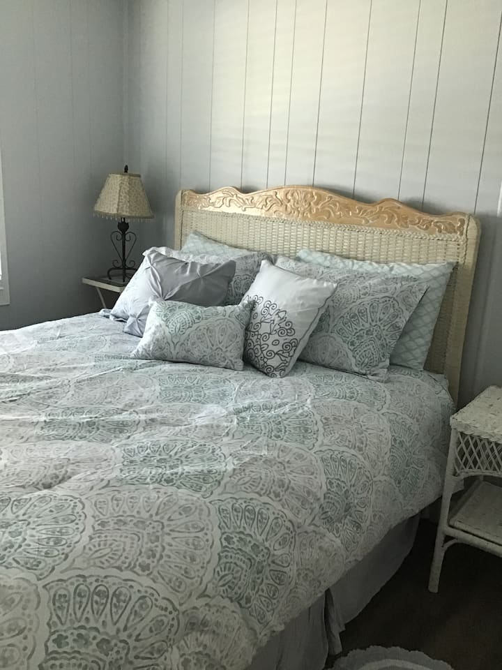 Third bedroom features queen size bed.  Window has river view.