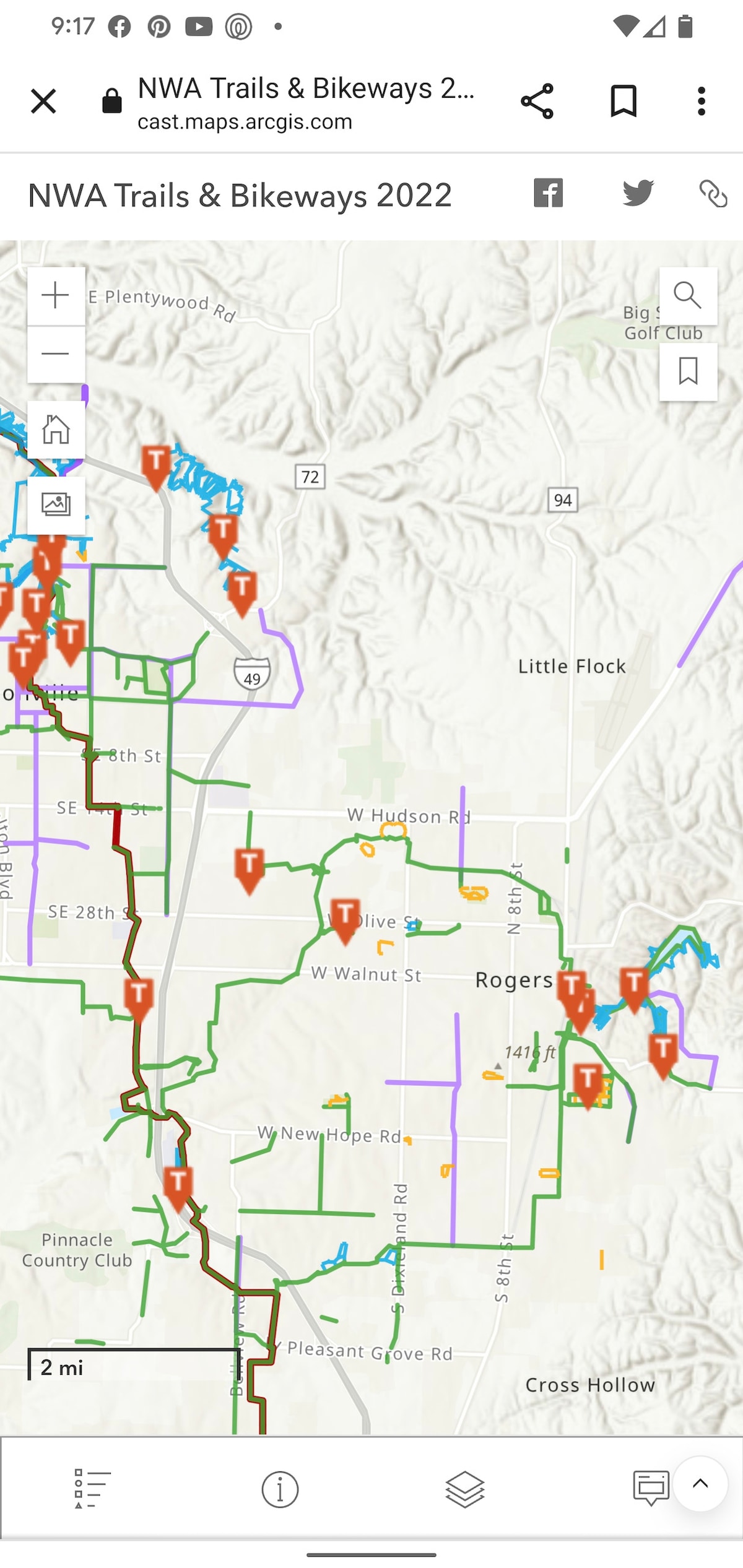A detailed map showcases the extensive network of trails and bikeways in northwest Arkansas, with clearly marked paths in green and roads in various colors. Notable landmarks and points of interest are indicated, facilitating navigation in the Rogers area.