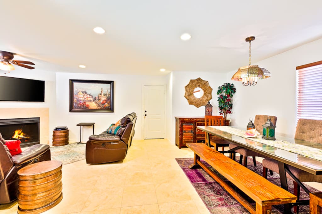 Here is a view of the Dining Area, the Living Room and you can see the door to the garage.